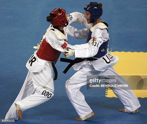 Diana Lopez of the US fights against Azize Tanrikulu of Turkey during the quarter-final of the women's -57 kg taekwondo match during the 2008 Beijing...