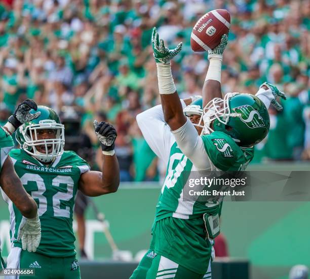 Duron Carter of the Saskatchewan Roughriders celebrates a touchdown with teammates in the game between the Toronto Argonauts and Saskatchewan...