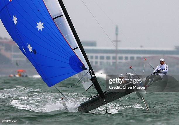 Darren Bundock and Glenn Ashby of Australia compete on their way to finishing second in the Tornado class event held at the Qingdao Olympic Sailing...