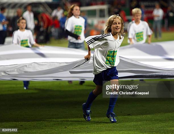 Ballboys present the Egidius Braun foundation on T-Shirts during the international friendly match between Germany and Belgium at the easyCredit...