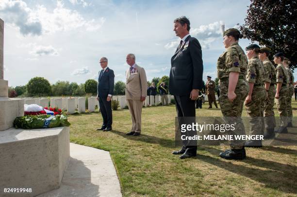 Flemish Minister-President Geert Bourgeois, Britain's Prince Charles and Vice Admiral Sir Timothy Laurence stand after laying a wreath during a...