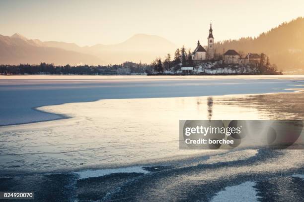 bled island at sunrise - slovenia mountains stock pictures, royalty-free photos & images