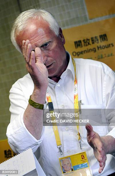 Hanfried Haring, general secretary of the German Equestrian Federation, gestures as he speaks to the press in Hong Kong on August 21, 2008 just hours...