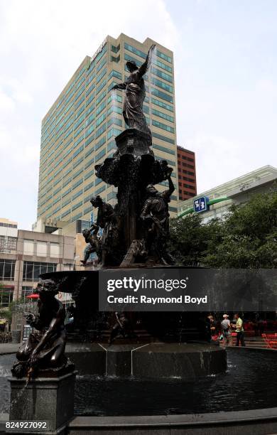 August von Kreling's Tyler Davidson Fountain or 'The Genius of Water' fountain sits in Fountain Square in Cincinnati, Ohio on July 22, 2017....