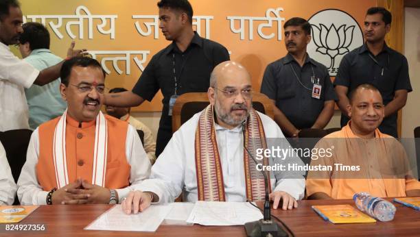 National President Amit Shah along with UP Chief Minister Yogi Adityanath and Deputy CM Keshav Prashad Maurya holds a press conference at BJP office...