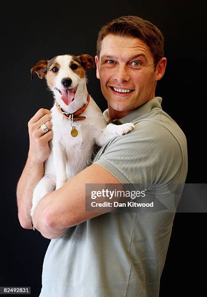 Eastenders actor John Partridge poses for a portrait with his Jack Russell Tilly at the launch of the PDSA 'Pawtraits' calander on August 21, 2008 in...