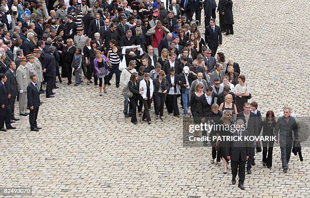 Relatives of the 10 French soldiers killed this week during fighting following a Taliban ambush near Kabul, arrive at the Invalides in Paris, on...