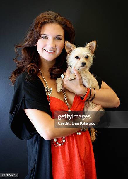 West End star Summer Strallen poses for a portrait with het Maltese Chihuahua Bam Bam at the launch of the PDSA 'Pawtraits' calander on August 21,...