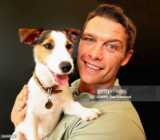 Eastenders actor John Partridge poses for a portrait with his Jack Russell Tilly at the launch of the PDSA 'Pawtraits' calander on August 21, 2008 in...