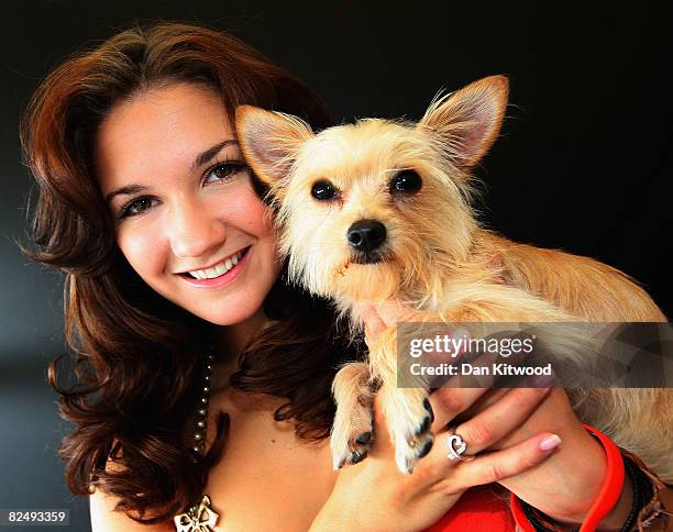 West End star Summer Strallen poses for a portrait with het Maltese Chihuahua Bam Bam at the launch of the PDSA 'Pawtraits' calander on August 21,...
