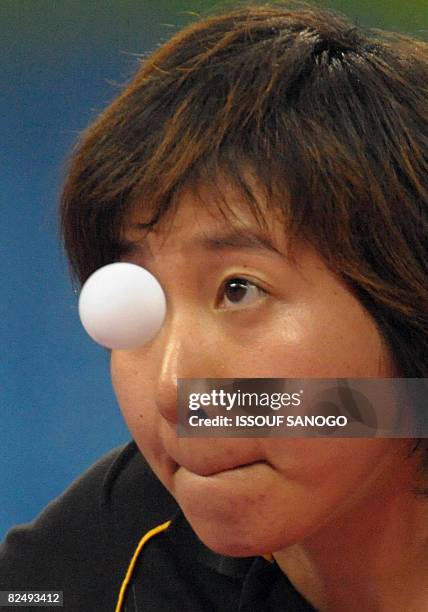 Wu Xue of Dominican Republic plays against Guo Yue of China during their women's table tennis singles quarter final match at the 2008 Beijing Olympic...