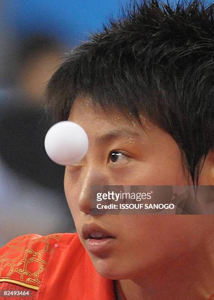 Guo Yue of China plays against Wu Xue of Dominican Republic during their women's table tennis singles quarter final match at the 2008 Beijing Olympic...
