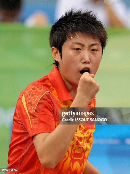 Guo Yue of China celebrates during her women's table tennis singles quarter final match gainst Wu Xue of Dominican Republic at the 2008 Beijing...