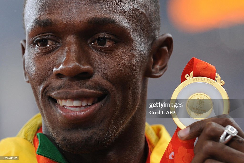 Jamaica's gold medalist Usain Bolt poses