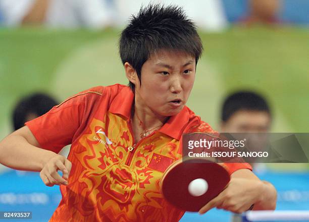 Guo Yue of China plays against Wu Xue of Dominican Republic during their women's table tennis singles quarter final match at the 2008 Beijing Olympic...