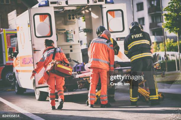 paramedics and firefighters - emergency first response stock pictures, royalty-free photos & images