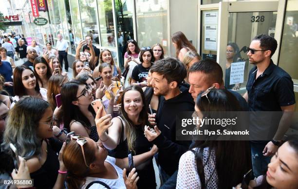 Fans greet Louis Tomlinson at Music Choice on July 31, 2017 in New York City.