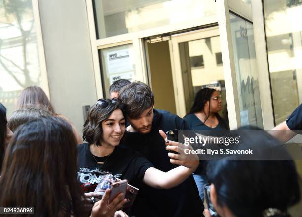 Fans greet Louis Tomlinson at Music Choice on July 31, 2017 in New York City.