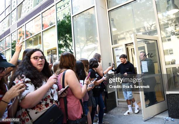 Fans greet Louis Tomlinson at Music Choice on July 31, 2017 in New York City.