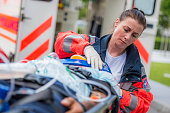Female paramedic with patient