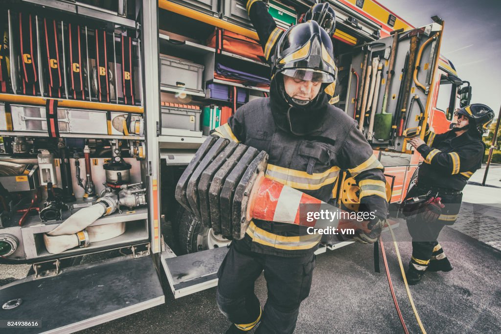 Fire engine and firefighters