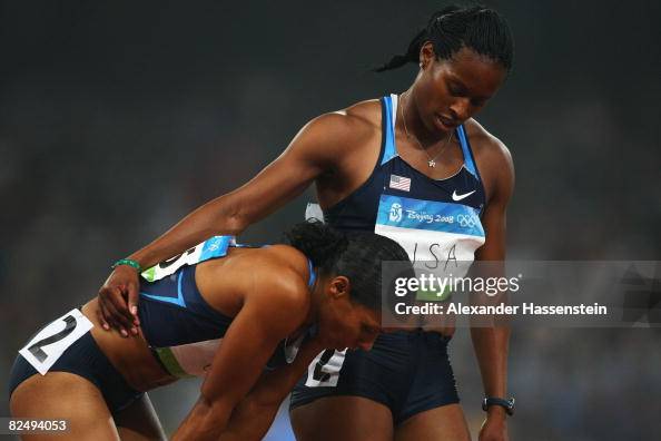 Mechelle Lewis of the United States comforts Torri Edwards of the