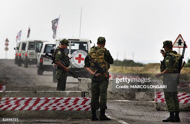 Red Cross vehicles drive through a Russian checkpoint in Khurvaleti, on August 21, 2008. The separatist leader of Georgia's South Ossetia region on...