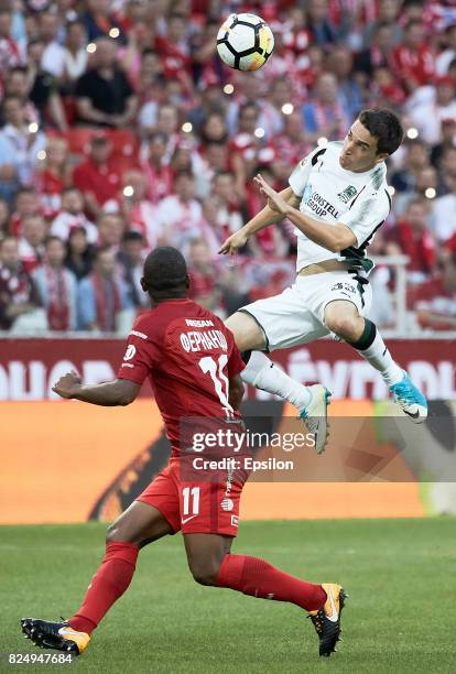 Fernando FC Spartak Moscow vies for the ball with Mauricio Pereyra of FC Krasnodar during the Russian Premier League match between FC Spartak Moscow...