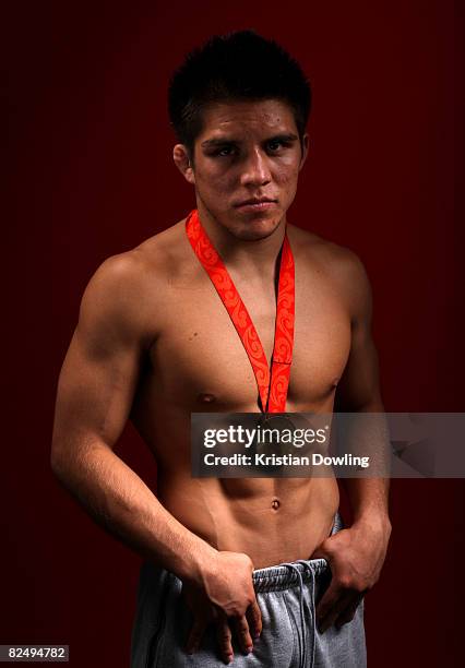 Henry Cejudo of the United States poses with his gold medal in the NBC Today Show Studio after winning the Men's 55kg Freestyle Wrestling at the...