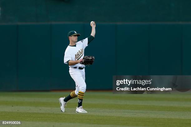 Jaycob Brugman of the Oakland Athletics fields the ball at center field in the fifth inning against the Minnesota Twins at Oakland Alameda Coliseum...