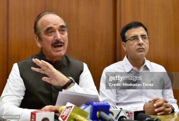 Congress leaders Ghulam Nabi Azad and Randeep Singh Surjewala address a press conference on flood situation, at Parliament House on July 31, 2017 in...