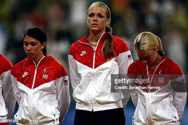Andrea Duran, Jennie Finch and Caitlin Lowe of the United States receive their silver medals after USA lost 3-1 to Japan during the women's grand...