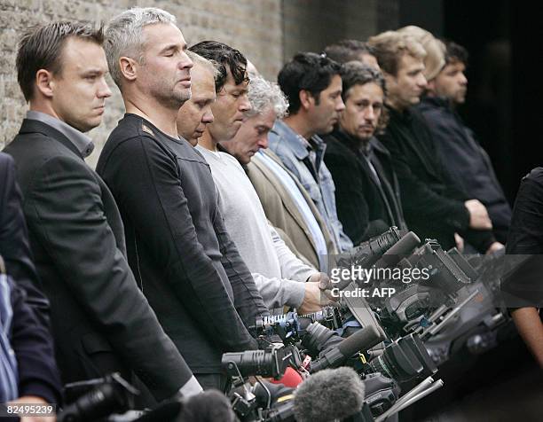 Dutch cameramen have put their cameras on the ground during the funeral of their mlate colleague Stan Storimans, on August 21, 2008 in Tilburg....