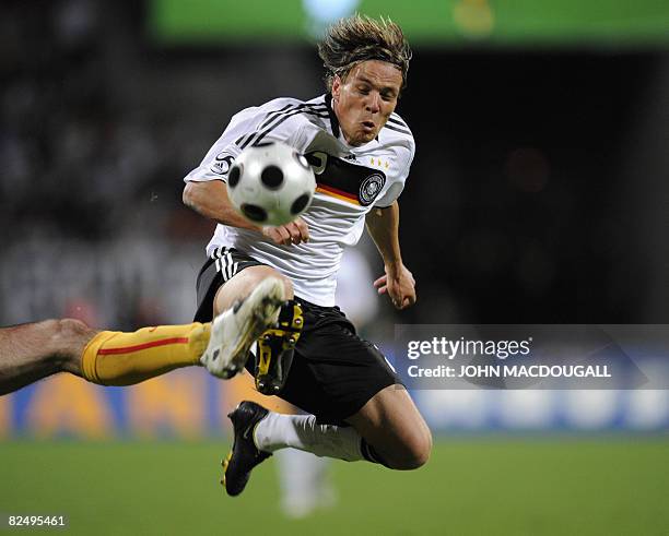 Germany's defender Clemens Fritz is intercepted by Belgium's Bart Goor during the Germany vs Belgium international friendly football match in...