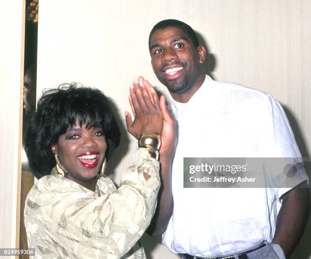 Actress and TV Personality Oprah Winfrey with NBA Star Magic Johnson at Tyson vs Spinks Convention Hall in Atlantic City, New Jersey June 27 1988.