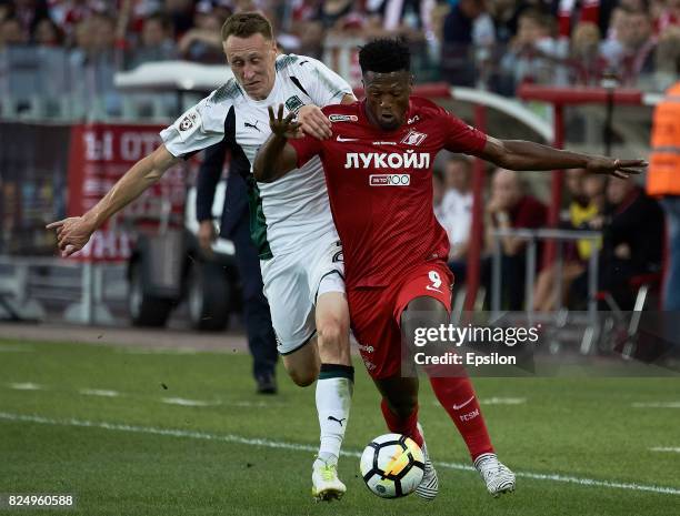 Ze Luis FC Spartak Moscow vies for the ball with Aleksei Gritsayenko of FC Krasnodar during the Russian Premier League match between FC Spartak...