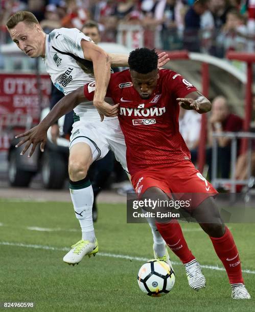 Ze Luis FC Spartak Moscow vies for the ball with Aleksei Gritsayenko of FC Krasnodar during the Russian Premier League match between FC Spartak...