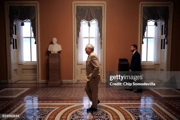 Senate Majority Leader Mitch McConnell returns to his office after bringing the Senate into session at the U.S. Capitol July 31, 2017 in Washington,...