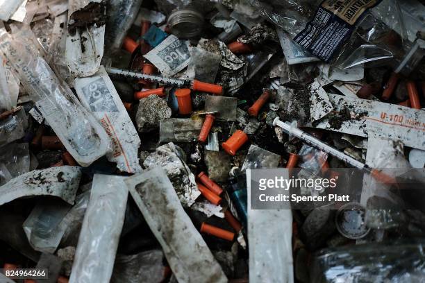Used needles are left behind in what was a heroin shooting gallery in the Kensington section of Philadelphia which has become a hub for heroin use on...