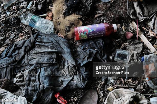 Clothes and trash are left behind in what was a heroin shooting gallery in the Kensington section of Philadelphia which has become a hub for heroin...