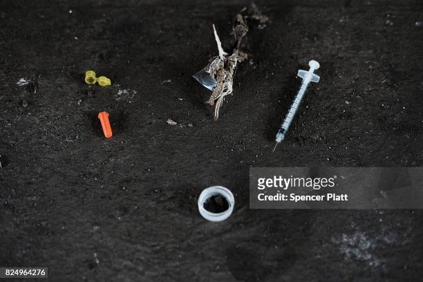 Used needles are left behind in what was a heroin shooting gallery in the Kensington section of Philadelphia which has become a hub for heroin use on...