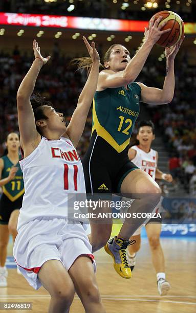 China's Tingting Shao tries to block Australia's Belinda Snell during their women's semi-final basketball match China against Australia of the...
