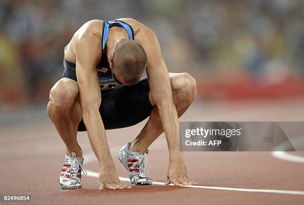 Jeremy Wariner of the US reacts following the men's 400m final at the "Bird's Nest" National Stadium during the 2008 Beijing Olympic Games on August...