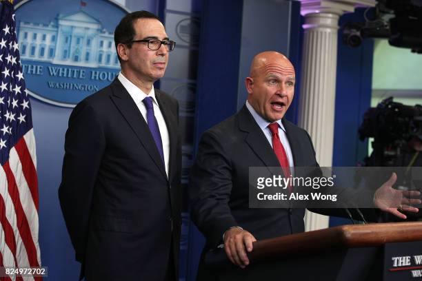 National Security Adviser H.R. McMaster speaks as U.S. Treasury Secretary Steven Mnuchin listens during a daily briefing at the James Brady Press...