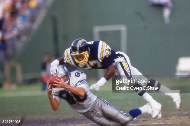 Steve Largent of the Seattle Seahawks makes a catch against the San Diego Chargers at Jack Murphy Stadium circa 1988 in San Diego, California.