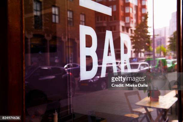 close-up message 'bar' on window in the city - store window stock pictures, royalty-free photos & images