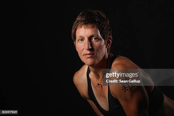 German olympic rower Kathrin Boron poses for a picture with a tattoo of her Chinese zodiac, the Rooster, on June 26, 2008 near Potsdam, Germany.