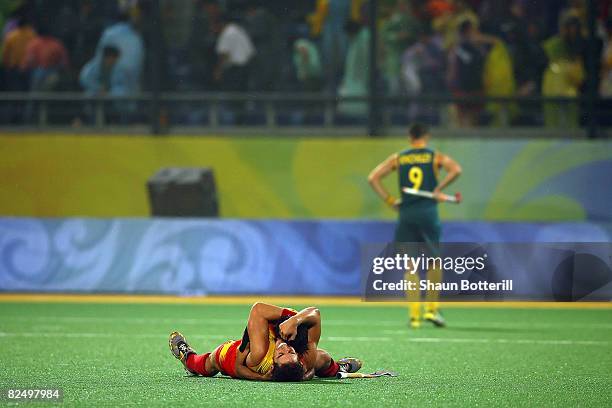 Eduard Arbos of Spain and teammate celebrate winning 3-2 over Australia in the men's semifinal match held at the Olympic Green Hockey Field during...