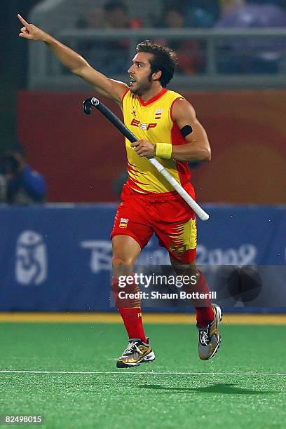 Eduard Tubau of Spain celebrates winning 3-2 over Australia in the men's semifinal match held at the Olympic Green Hockey Field during Day 13 of the...