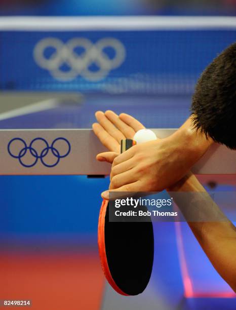 Dimitrij Ovtcharov of Germany serves to Adrian Crisan of Romania during their men's table tennis single preliminary match during Day 12 of the...